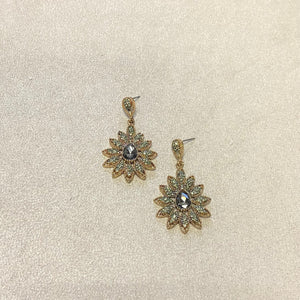 Arete flor azul-dorado