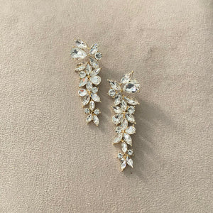 Arete largo tipo flor dorado-plata