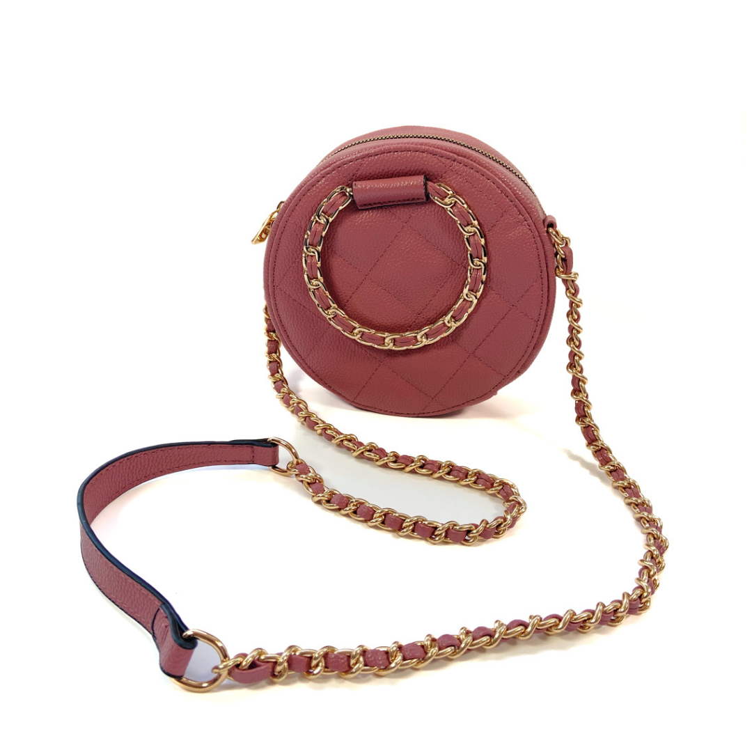 Bolsa crossbody capitonada circular mauve