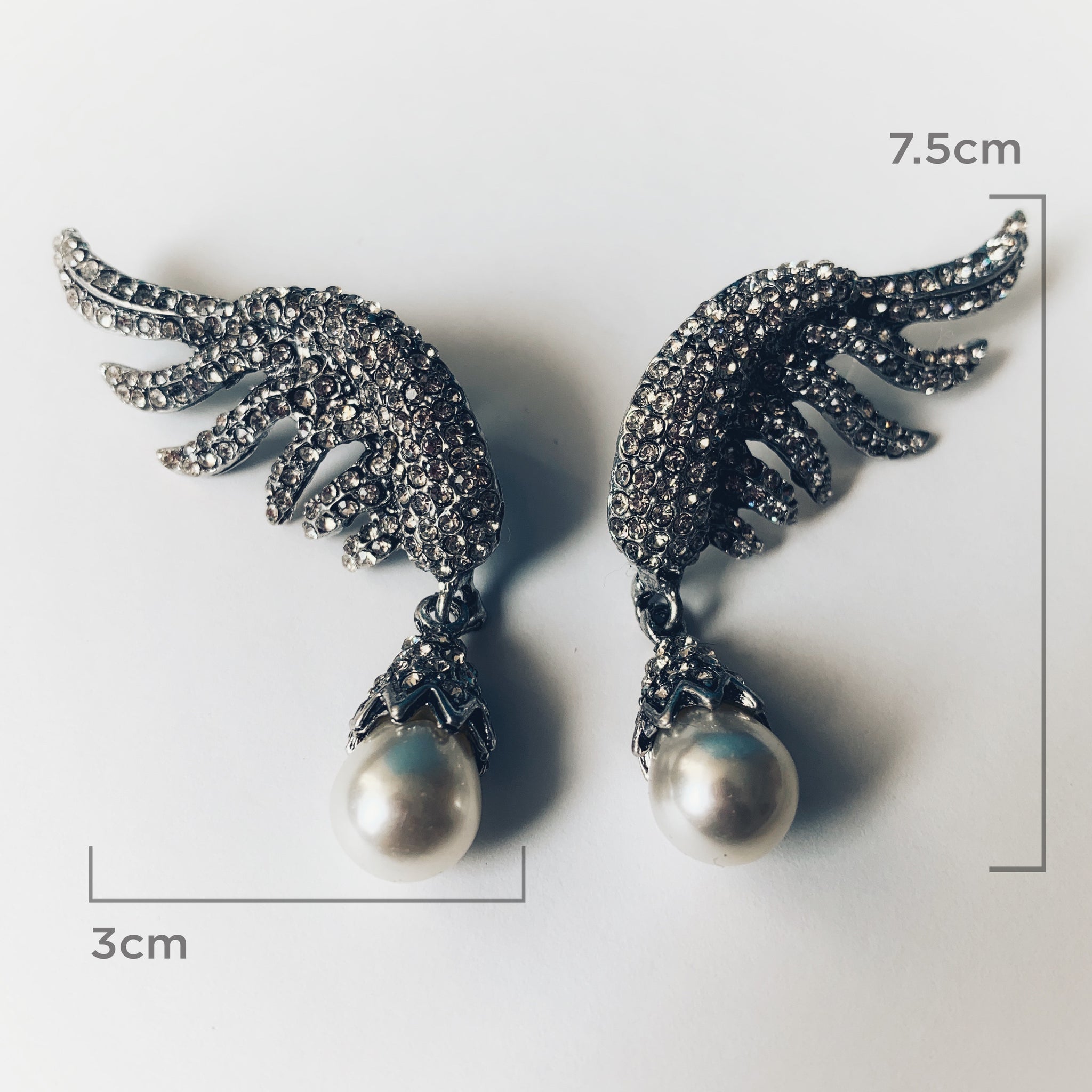Aretes alas con perla